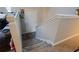 Interior stairway leading to the front door with neutral walls and gray carpet at 3981 Rocmar Dr, Snellville, GA 30039