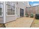 This backyard features a small patio and privacy fencing at 6374 Rockaway Rd, Atlanta, GA 30349