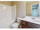 This bathroom offers a tub-shower combination and a vanity with plenty of counter space at 6374 Rockaway Rd, Atlanta, GA 30349