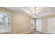 This bedroom offers a tray ceiling with fan and plenty of natural light from its two large windows at 6374 Rockaway Rd, Atlanta, GA 30349