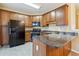 The kitchen is equipped with wood cabinets, black appliances, and a counter at 6374 Rockaway Rd, Atlanta, GA 30349