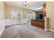 Kitchen and dining area with wood cabinets, stainless steel appliances, and a bay window at 6374 Rockaway Rd, Atlanta, GA 30349