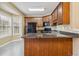 Bright kitchen featuring granite countertops, stainless steel appliances, and a bay window at 6374 Rockaway Rd, Atlanta, GA 30349
