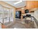 Well-lit kitchen with granite countertops and stainless steel appliances at 6374 Rockaway Rd, Atlanta, GA 30349