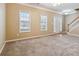 The living room features neutral walls and a large window for natural light at 6374 Rockaway Rd, Atlanta, GA 30349