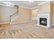 Cozy living room featuring a fireplace, neutral walls, and plush carpeting at 6374 Rockaway Rd, Atlanta, GA 30349