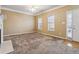 Spacious living area with large windows and a ceiling fan at 6374 Rockaway Rd, Atlanta, GA 30349