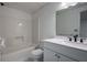 Bathroom with tub-shower combo, and updated single sink vanity at 1285 Glandor Se Ct, Mableton, GA 30126