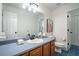 Full bathroom with modern vanity, blue tile floor, and framed mirror at 1285 Glandor Se Ct, Mableton, GA 30126