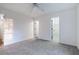 Bright bedroom features neutral carpet, ceiling fan, and closet at 1285 Glandor Se Ct, Mableton, GA 30126