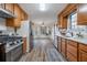 Bright kitchen showcasing stainless steel appliances, white counters and oak cabinets at 1285 Glandor Se Ct, Mableton, GA 30126