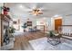 Spacious living room featuring a fireplace, ceiling fan, and smooth floors at 1285 Glandor Se Ct, Mableton, GA 30126