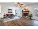 Open-concept living room features a fireplace and hardwood-style flooring at 1285 Glandor Se Ct, Mableton, GA 30126