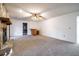 Spacious living room with stone fireplace, bar area, and plush carpet at 1285 Glandor Se Ct, Mableton, GA 30126