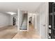 Inviting entryway featuring tiled floors, stairs to the upper level, and access to other rooms in the home at 217 Quail Run, Roswell, GA 30076