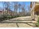 Expansive backyard with perimeter trees and shrubs offer additional privacy at 440 Belada Blvd, Sandy Springs, GA 30342