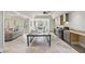 Finished basement with ping pong table, sofa, kitchen area and dining area at 440 Belada Blvd, Sandy Springs, GA 30342