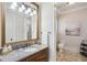 Elegant bathroom with granite countertop, wood vanity, and decorative mirror, offering a luxurious feel at 440 Belada Blvd, Sandy Springs, GA 30342