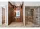Bathroom featuring built-in storage, double shower heads, and tile flooring at 440 Belada Blvd, Sandy Springs, GA 30342