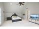 Spacious bedroom with high ceilings, a ceiling fan, and a TV stand, perfect for relaxation and entertainment at 440 Belada Blvd, Sandy Springs, GA 30342