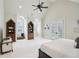 Bright bedroom featuring built-in shelves, ample storage, and a cozy seating area for relaxation at 440 Belada Blvd, Sandy Springs, GA 30342
