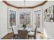 Breakfast nook features hardwood floors, recessed lighting and a modern chandelier with views of the backyard at 440 Belada Blvd, Sandy Springs, GA 30342