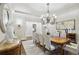 Formal dining room features updated chandelier, hardwood floors, and access to the foyer at 440 Belada Blvd, Sandy Springs, GA 30342