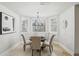 Dining room featuring stylish seating around a round table under a decorative chandelier at 440 Belada Blvd, Sandy Springs, GA 30342