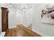 Hallway features hardwood floors, custom trim and moldings, and recessed lighting at 440 Belada Blvd, Sandy Springs, GA 30342