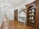 Hallway boasts hardwood flooring, detailed trim, and custom built-in shelving at 440 Belada Blvd, Sandy Springs, GA 30342