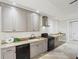 Kitchenette with sleek cabinets, granite countertops, and stainless steel appliances at 440 Belada Blvd, Sandy Springs, GA 30342
