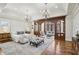Spacious main bedroom with sitting area, decorative lighting, and hardwood floors at 440 Belada Blvd, Sandy Springs, GA 30342