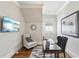 Comfortable home office with a built-in desk, stylish chairs, and serene decor for a productive workspace at 440 Belada Blvd, Sandy Springs, GA 30342