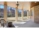 Covered patio with ceiling fan overlooks the backyard at 440 Belada Blvd, Sandy Springs, GA 30342