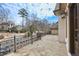 Open-air patio features stone flooring and a wrought iron railing at 440 Belada Blvd, Sandy Springs, GA 30342