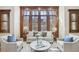 Sitting area with hardwood trim and floors, white furnishings, and modern decor at 440 Belada Blvd, Sandy Springs, GA 30342
