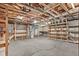 Spacious unfinished basement with shelving and exposed beams at 6165 Picketts Nw Rdg, Acworth, GA 30101