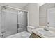 Bright bathroom featuring a glass shower door and neutral-toned vanity at 6165 Picketts Nw Rdg, Acworth, GA 30101