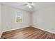 Cozy bedroom featuring a ceiling fan, and gleaming hardwood floors at 6165 Picketts Nw Rdg, Acworth, GA 30101