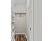 Closet with white shelves and wood floor at 6165 Picketts Nw Rdg, Acworth, GA 30101