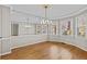 Elegant dining room with hardwood floors, chandelier, and large windows overlooking the yard at 6165 Picketts Nw Rdg, Acworth, GA 30101