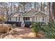 Charming single-Gathering home with beautiful landscaping and a cozy front porch, nestled among mature trees at 6165 Picketts Nw Rdg, Acworth, GA 30101