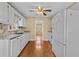 Functional kitchen area equipped with stainless steel appliances, granite countertops, and white cabinetry at 6165 Picketts Nw Rdg, Acworth, GA 30101