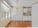 Cozy kitchenette featuring white cabinets, hardwood floors, ample natural light, and a breakfast area at 6165 Picketts Nw Rdg, Acworth, GA 30101