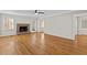 Spacious living room boasts a brick fireplace, hardwood floors, and large windows providing natural light at 6165 Picketts Nw Rdg, Acworth, GA 30101