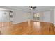 Bright open-concept living area with hardwood flooring, neutral walls, and a view into the kitchen at 6165 Picketts Nw Rdg, Acworth, GA 30101