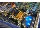 Night aerial view of condo amenities including a pool, lounge, and dining area, lit with ambient lighting at 943 Peachtree Ne St # 2009, Atlanta, GA 30309