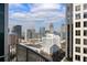 Stunning city view from a high-rise balcony, showcasing the architectural landscape and clear blue skies at 943 Peachtree Ne St # 2009, Atlanta, GA 30309