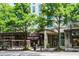 Commercial building with a bakery and fitness center located on a tree-lined street at 943 Peachtree Ne St # 2009, Atlanta, GA 30309