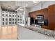 The kitchen features modern stainless steel appliances and granite countertops with a view to the living area at 943 Peachtree Ne St # 2009, Atlanta, GA 30309